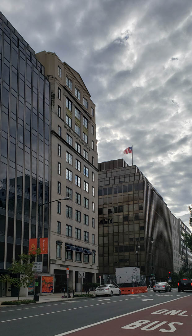 Clouds rolling in over Farragut Park and the Barr Building in DC
