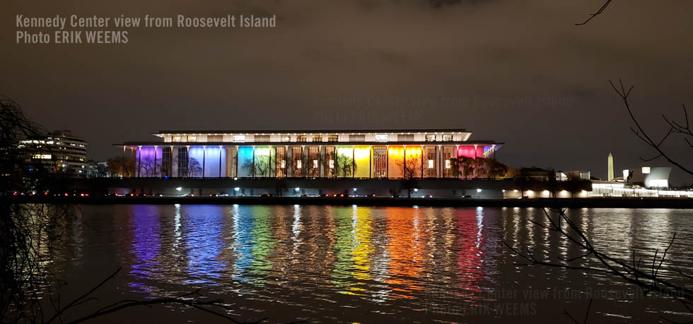 At night the rainbow lights of the Kennedy center at the Potomac viewed from Roosevelt Island At night the rainbow lights of the Kennedy Center at the Potomac viewed from Roosevelt Island
